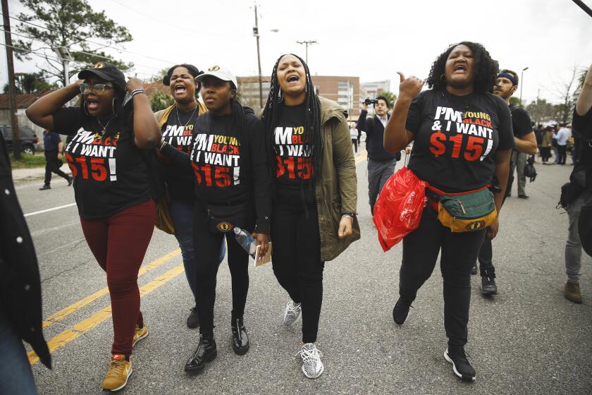 Members of Black Youth Project 100 call after Democratic presidential candidate former South Bend, Ind., Mayor Pete Buttigieg as he departs from a demonstration calling for a union and $15 minimum wage at McDonald's, Monday, Feb. 24, 2020, in Charleston, S.C. (AP Photo/Matt Rourke)