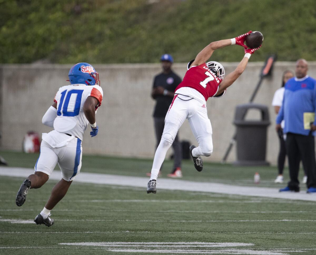  Orange Lutheran wide receiver Longevity Khanrad Pritchett makes a leaping catch.