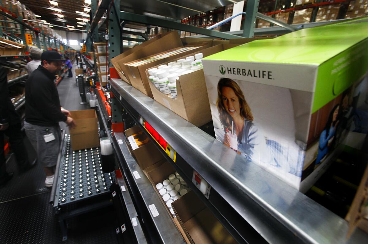 Orders are filled at the Herbalife distribution center in Carson in 2013.