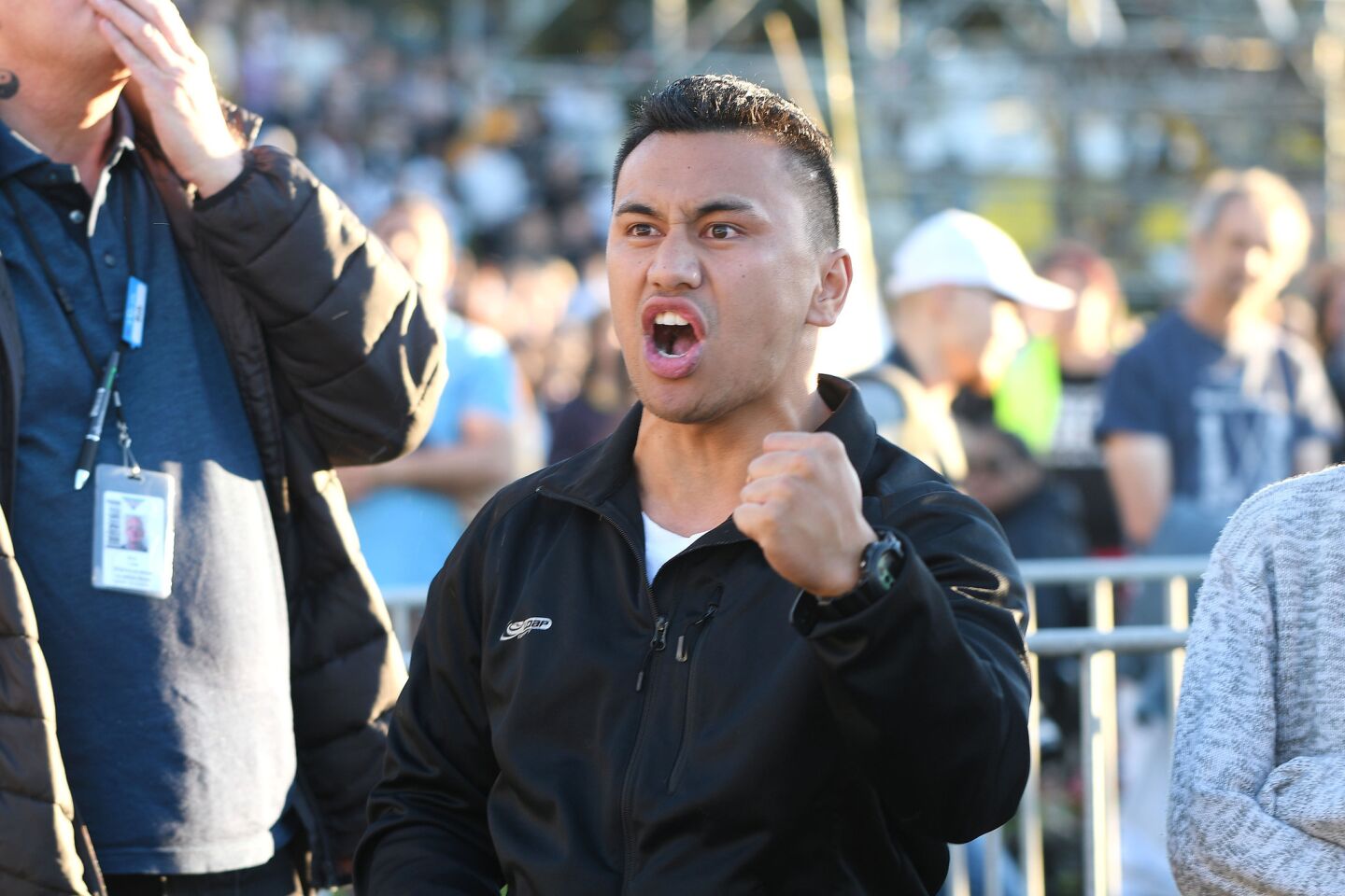 A man reacts during a vigil Sunday at the Basin Reserve in Wellington, New Zealand.
