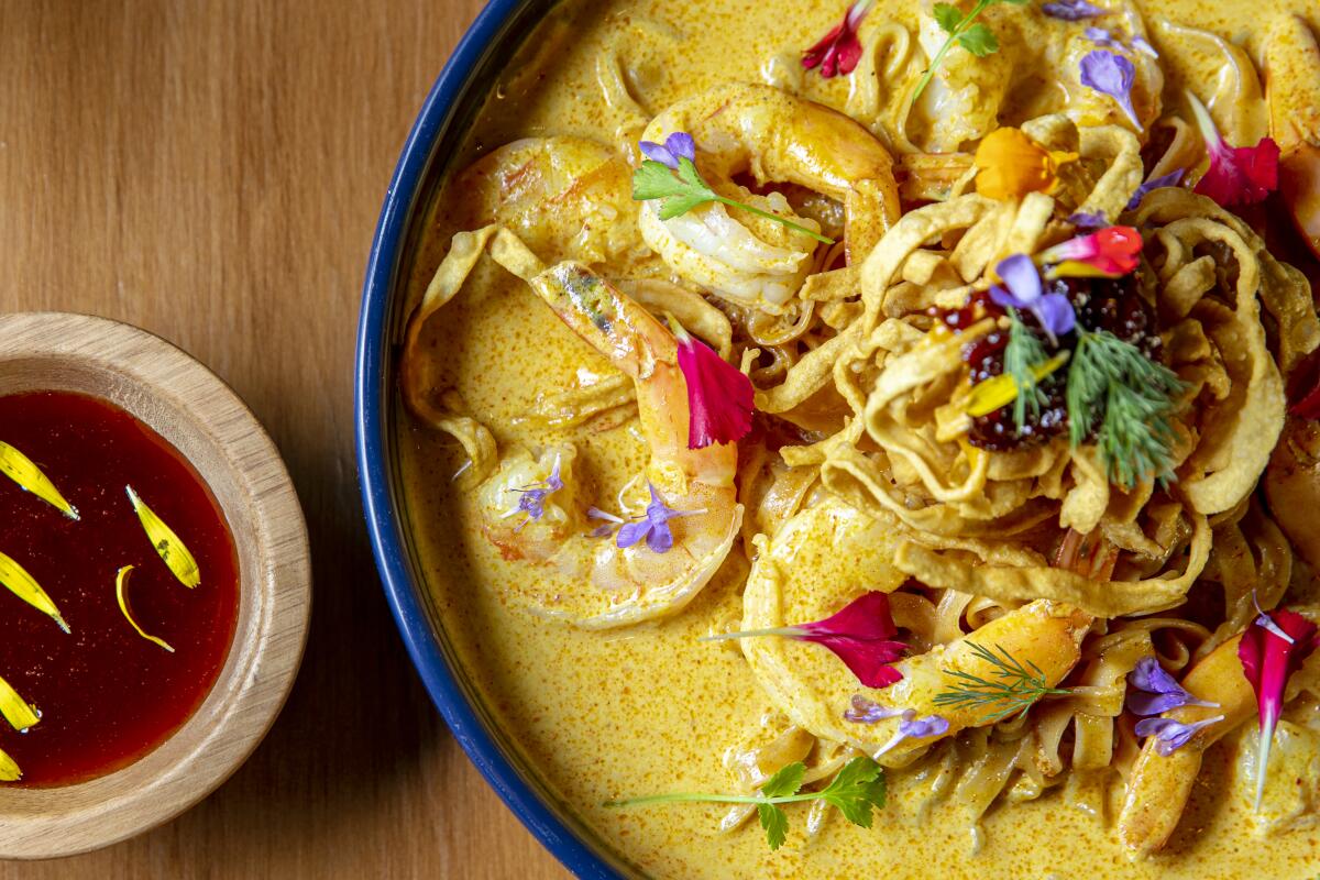 Ruam Mitr's shrimp Khao Soi: egg noodles in a rich Northern Thai yellow curry, topped with crispy noodles.