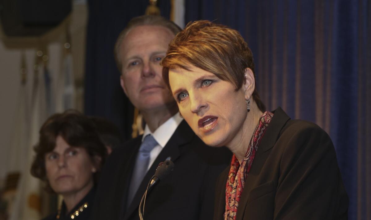 U.S. Atty. Laura Duffy, front, with San Diego Police Chief Shelley Zimmerman and Mayor Kevin Faulconer at a news conference Monday announcing a Department of Justice review of the city's Police Department.