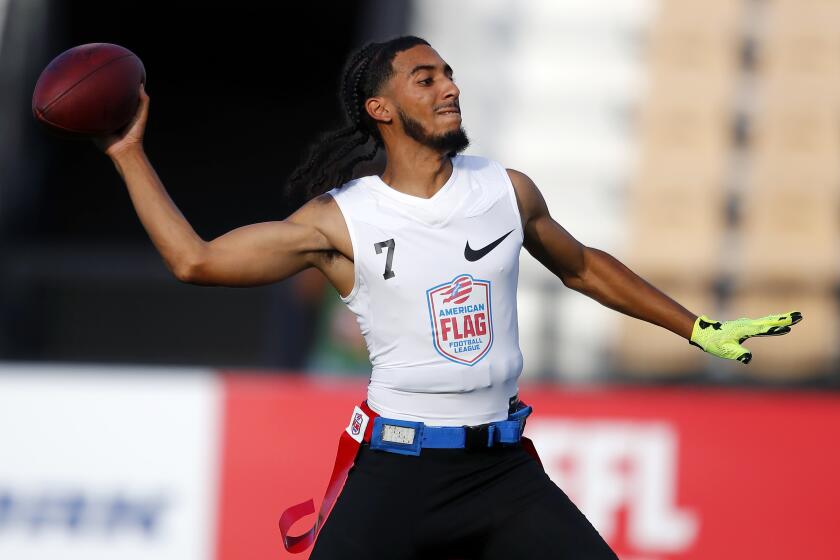 Fighting Cancer's Darrell Doucette passes during a semifinal round game at the AFFL U.S. Open of Football tournament