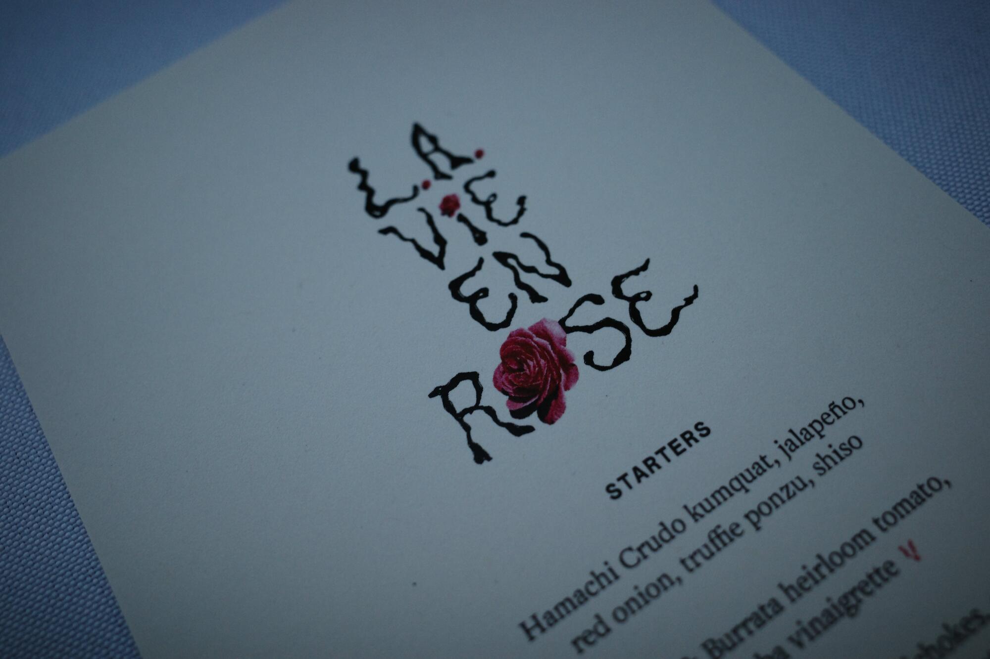 the top of a printed menu that reads “L.A. Vie en Rose”