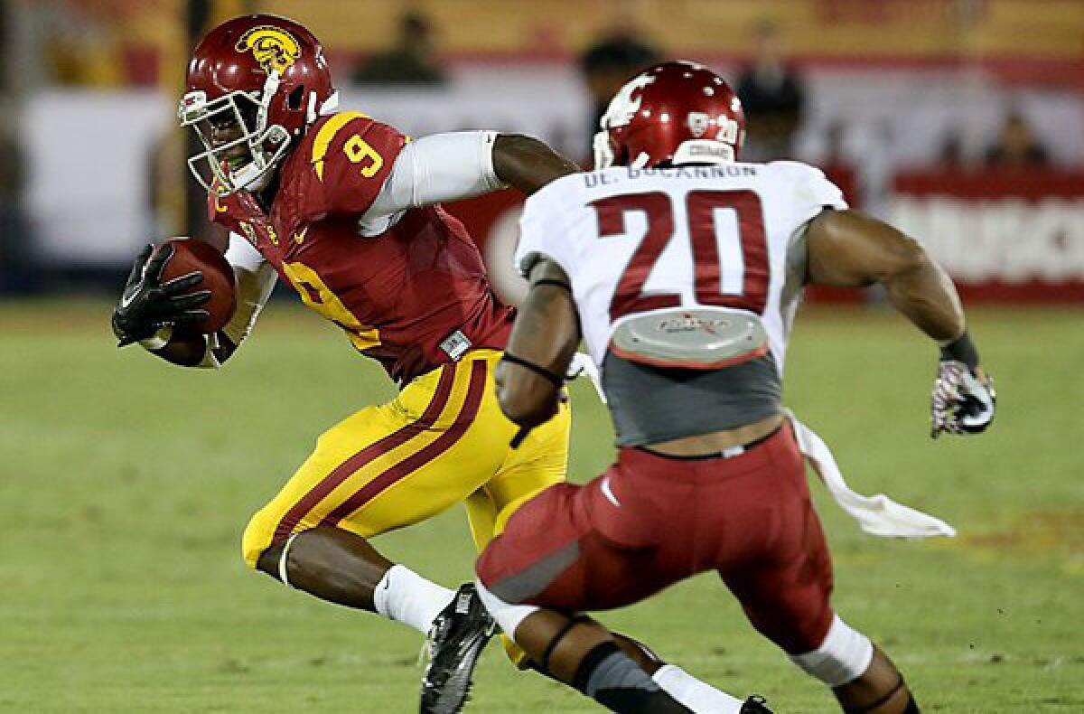 USC receiver Marquise Lee reverses field for extra yardage after making a catch against WSU defender Deone Bucannon during the third quarter Saturday night at the Coliseum.