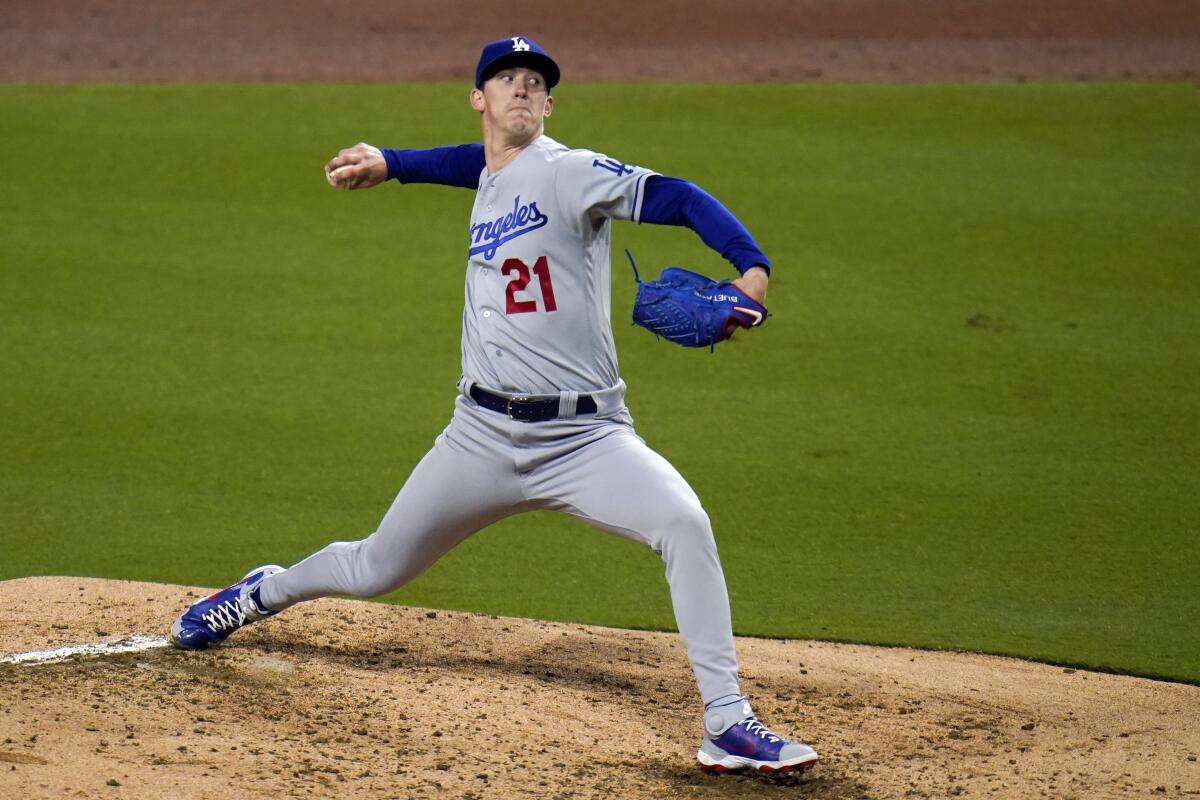 Los Angeles Dodgers starting pitcher Walker Buehler works against the Padres.