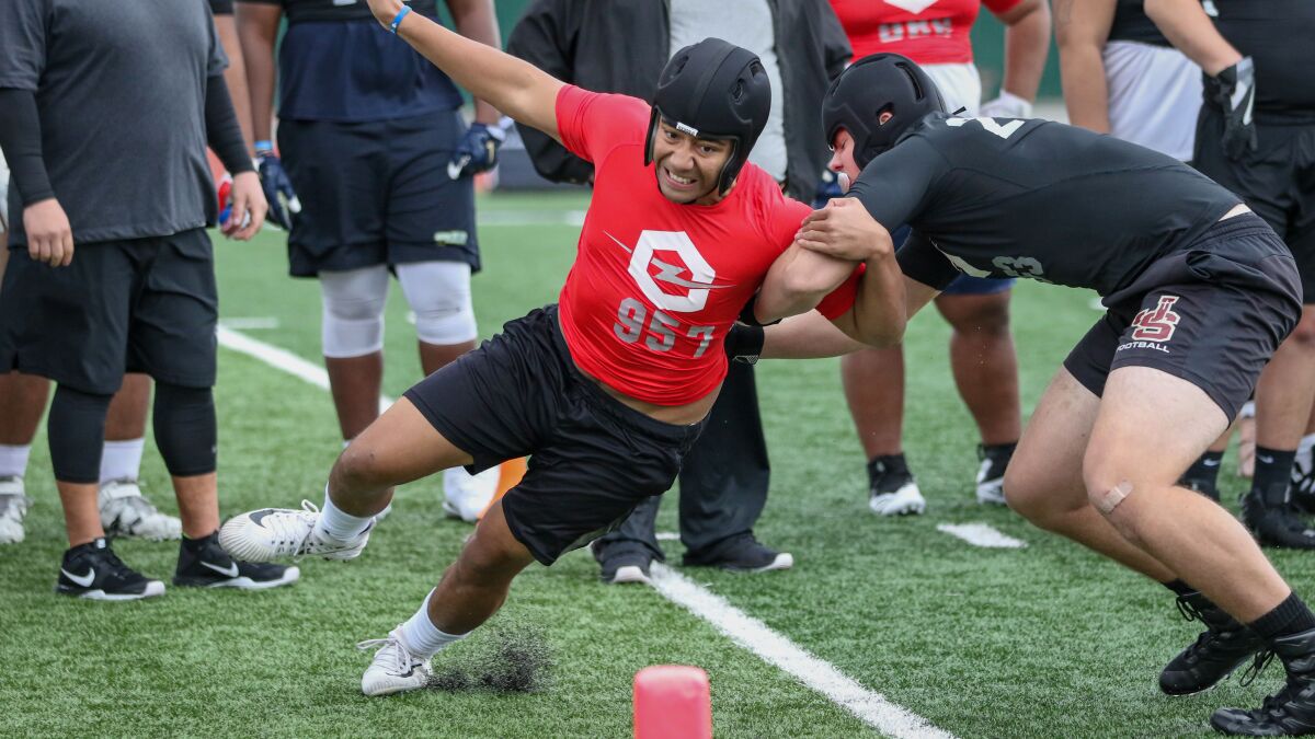 Defensive end Ioholani Raass from Skyridge High in Lehi, Utah gets around JSerra offensive lineman Jeffrey Persi during a one-on-one pass rush drill at the Opening Los Angeles regional on Feb. 10.