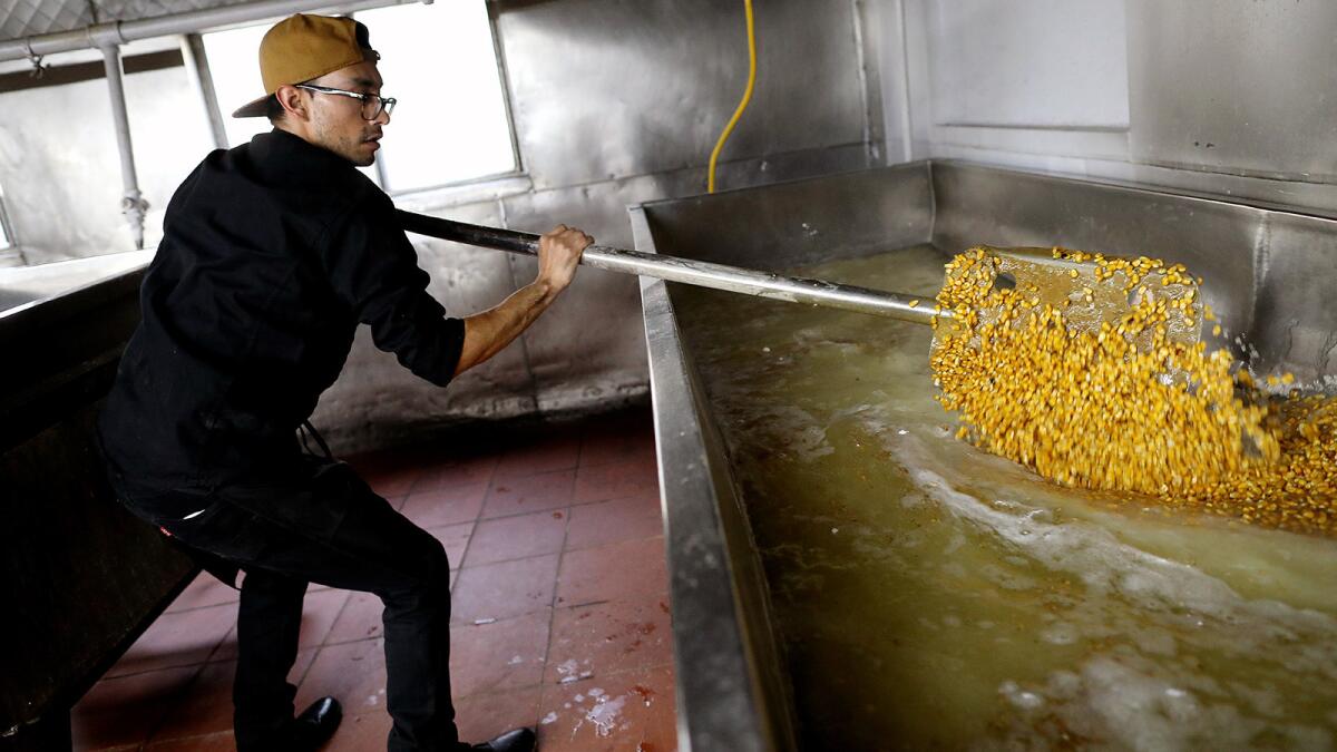 Rick Ortega, co-owner of Kernel of Truth, making yellow corn tortillas