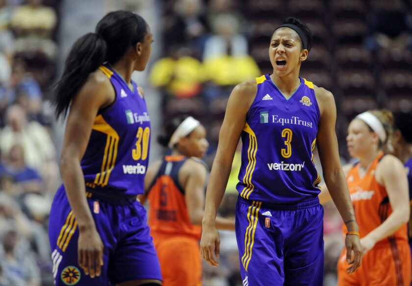 Sparks forward Candace Parker, right, talks to teammate Nneka Ogwumike, left, during the first half of a game against the Connecticut Sun on May 26.