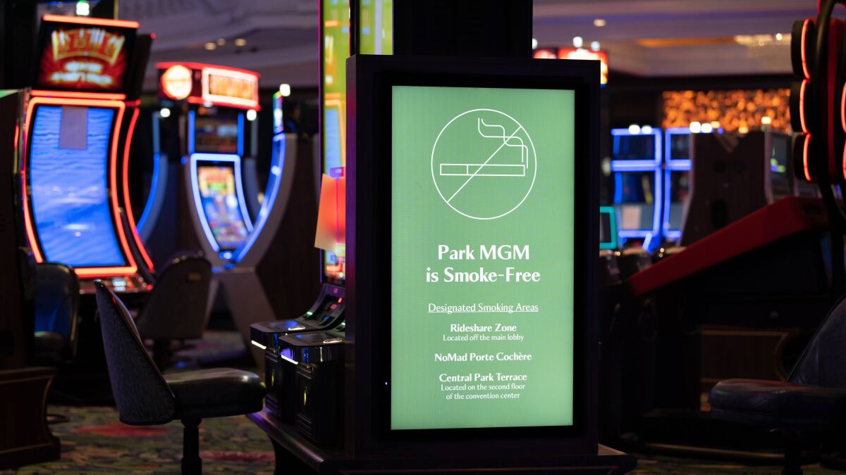 A sign on the smoke-free gaming floor at Park MGM directs guests to outdoor locations where they can light up.