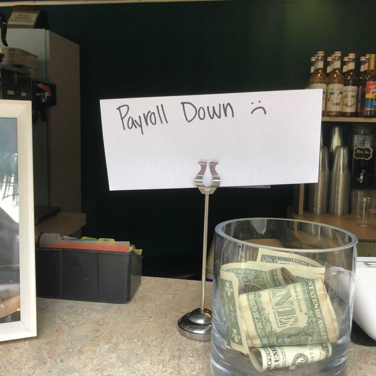 A handwritten sign at Scripps Memorial Hospital La Jolla on May 3 indicates cash-only cafe purchases due to a cyberattack.