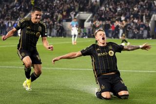 Los Angeles FC midfielder Mateusz Bogusz, right, celebrates his goal against Minnesota United with defender Sergi Palencia during the second half of an MLS soccer match Wednesday, May 29, 2024, in Los Angeles. (AP Photo/Ryan Sun)