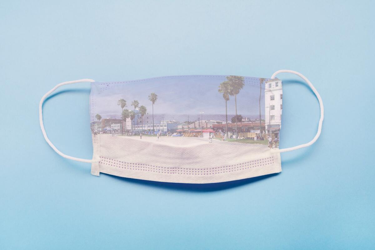 A facemask with an image of people playing at the beach projected onto it. 