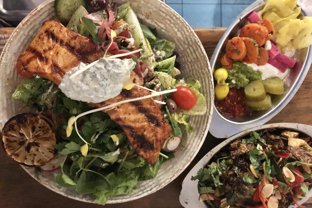 Grilled salmon salad and other dishes at Mizlala.