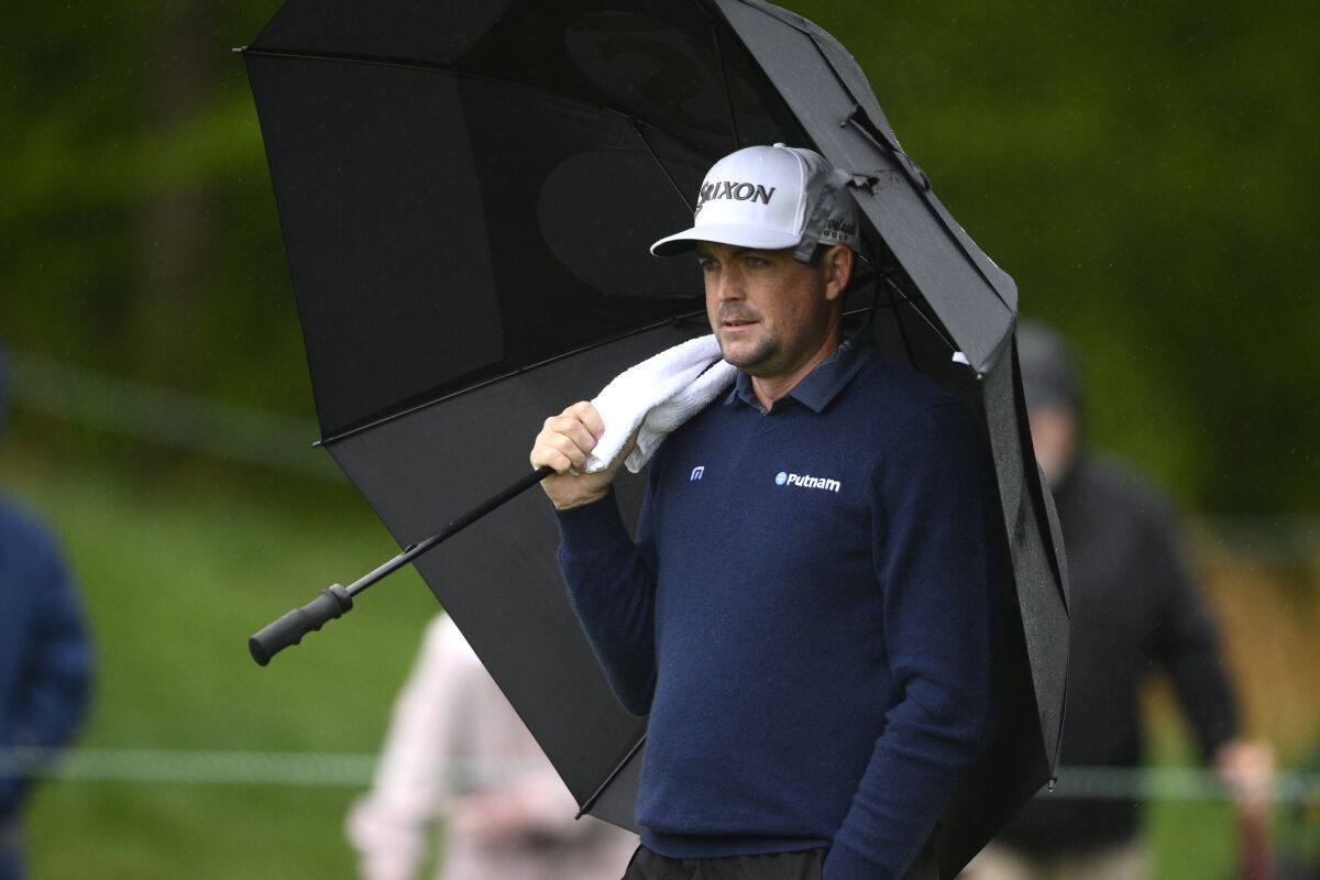 Keegan Bradley watches between shots on the seventh green during the third round of the Wells Fargo Championship golf tournament, Saturday, May 7, 2022, at TPC Potomac at Avenel Farm golf club in Potomac, Md. (AP Photo/Nick Wass)