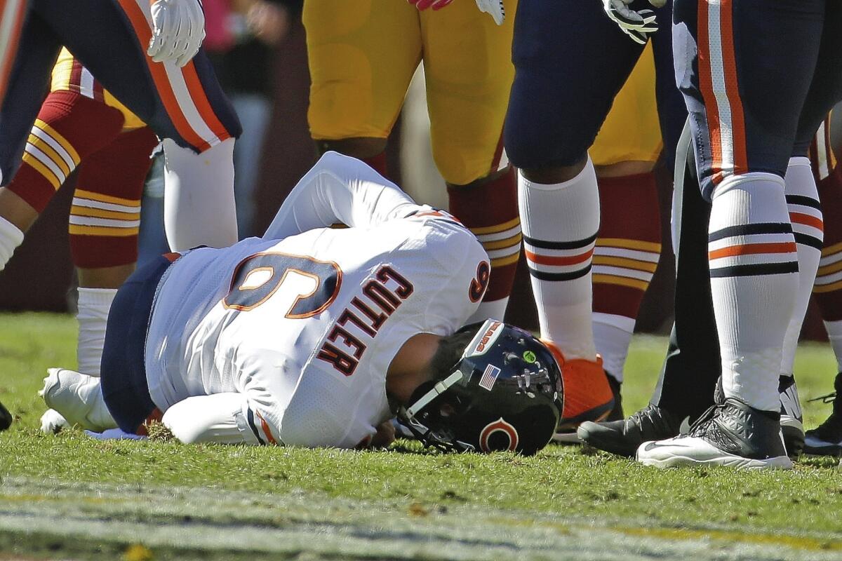 Chicago Bears quarterback Jay Cutler lies on the field after being injured in a sack by Washington Redskins defensive end Chris Baker on Sunday.