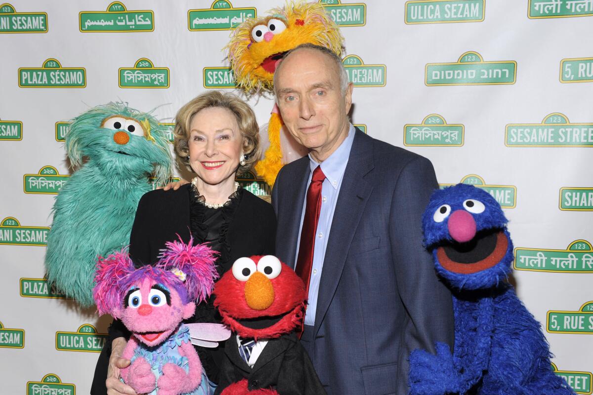 Lloyd Morrisett and Joan Ganz Cooney with "Sesame Street" characters in 2009.
