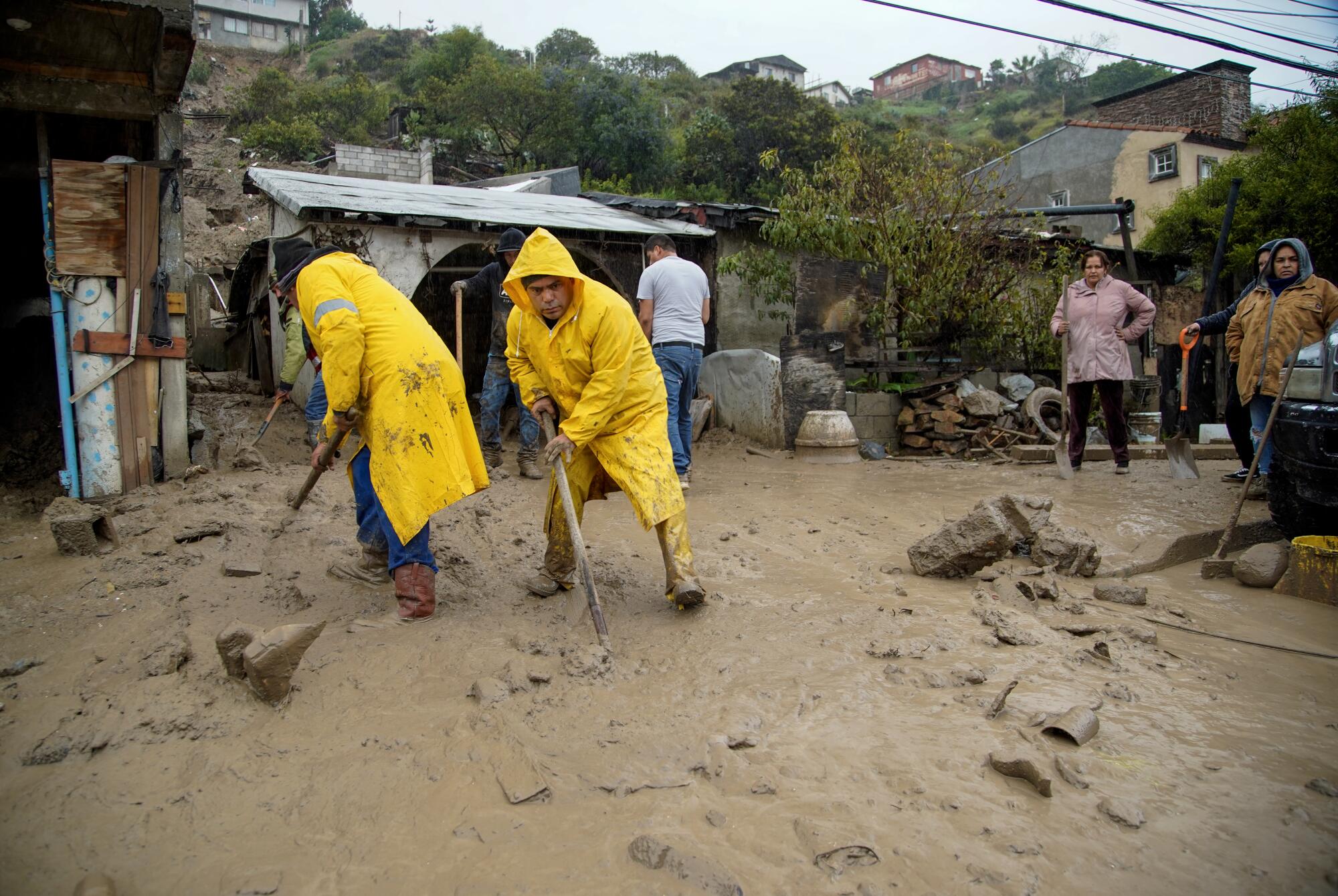 Two homes in Tijuana were partially destroyed after a hillside collapsed