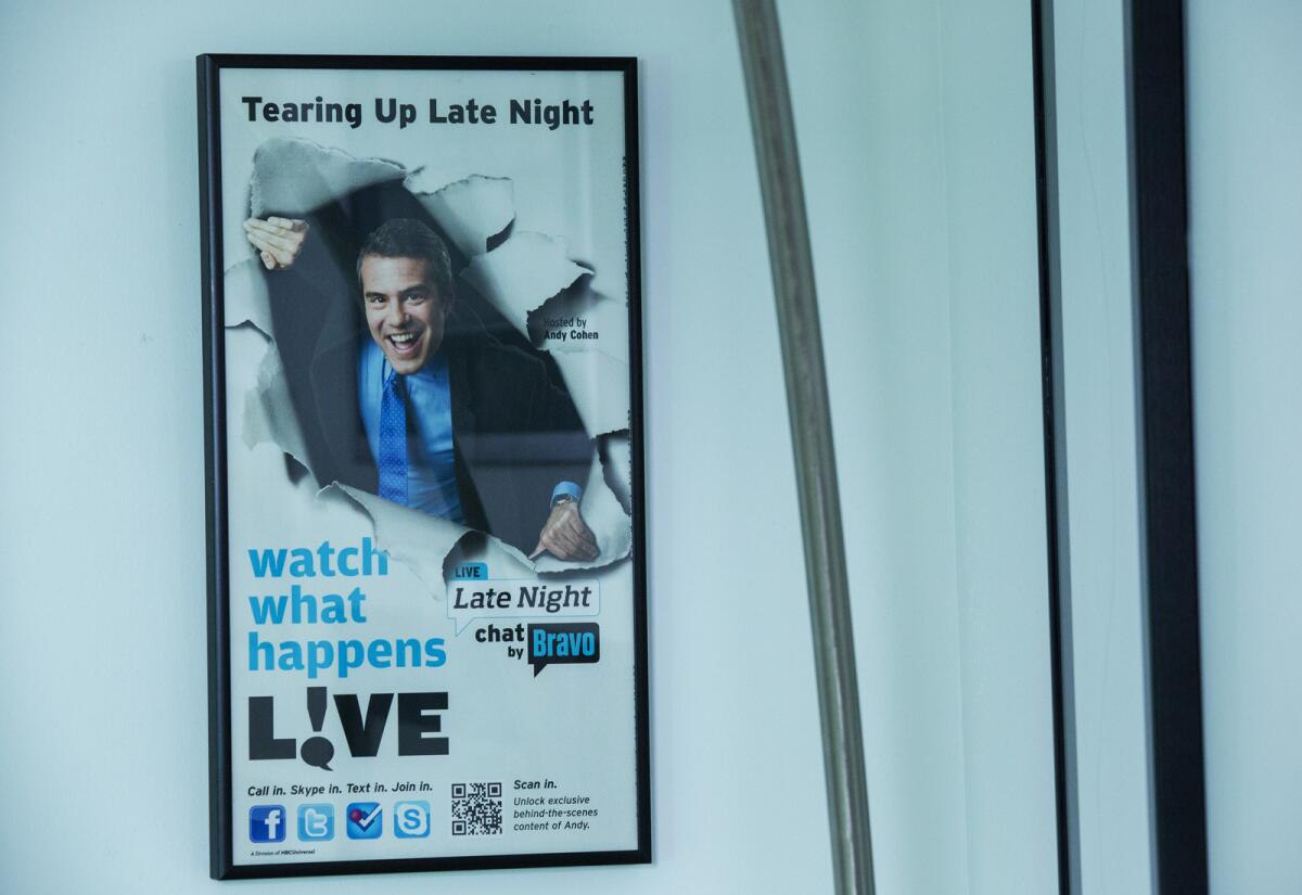 A "Watch What Happens Live with Andy Cohen" poster hangs inside the office of showrunner Deirdre Connolly.