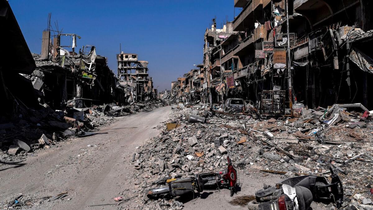 Heavily damaged buildings in Raqqa after a Kurdish-led force expelled Islamic State fighters from the northern Syrian city.