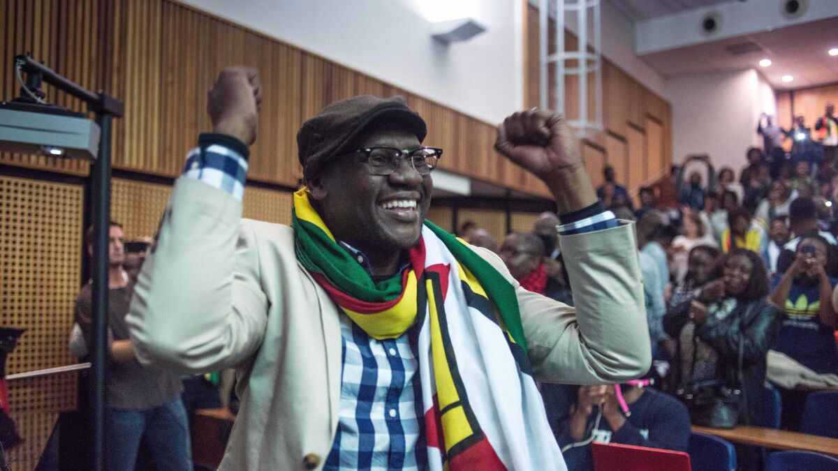 Zimbabwean Pastor Evan Mawarire gestures after addressing students during a lecture at the University of Witwatersrand in Johannesburg, on July 28, 2016. (Mujahid Safodien / AFP/Getty Images)