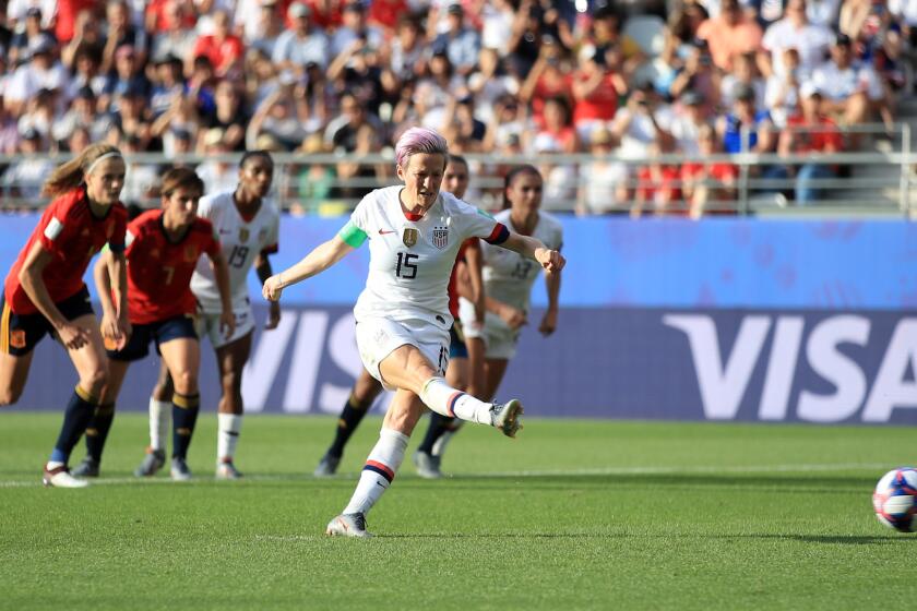 Megan Rapinoe of the U.S. scores her team's second goal against Spain from the penalty spot.