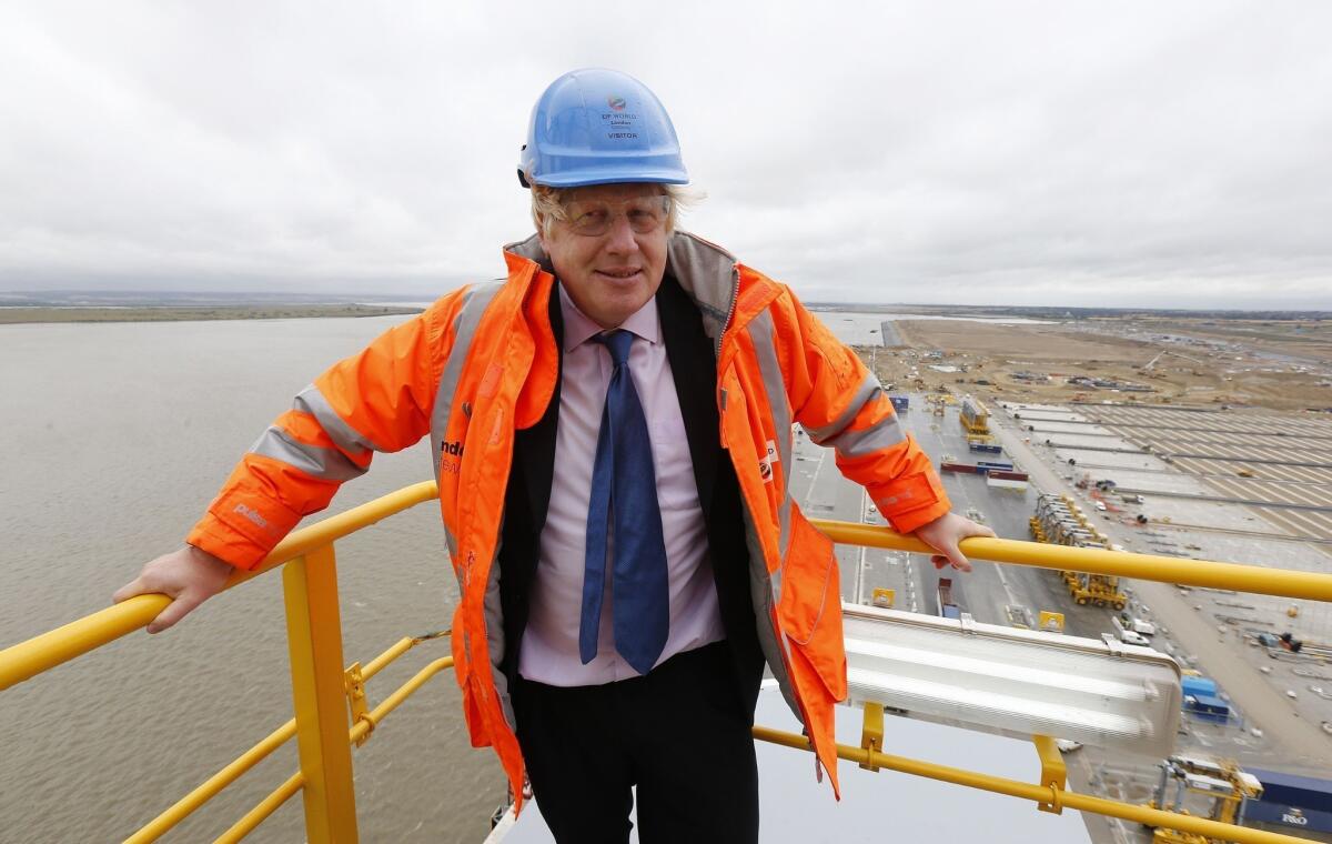 London Mayor Boris Johnson, posing on a crane at DP World London Gateway Port on July 30, plans to meet next month with representatives from the tech industry to ask them to build smartphones less attractive to thieves.
