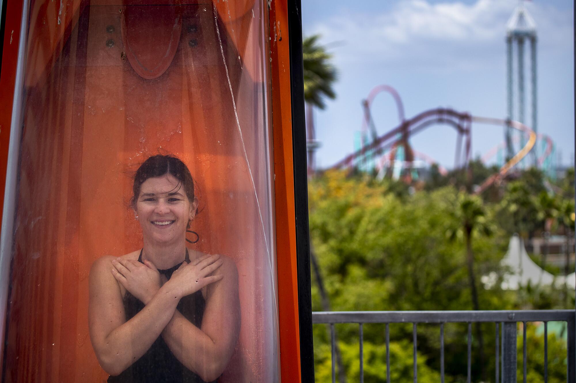 A woman prepares to be dropped into the water at Shore Break water slides.