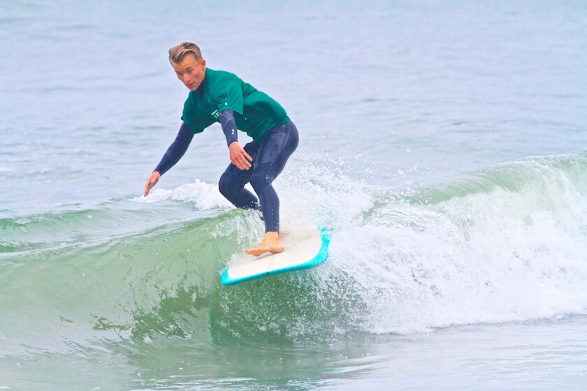A surfer in a previous Summer Longboard Classic hosted by the Pacific Beach Surf Club.