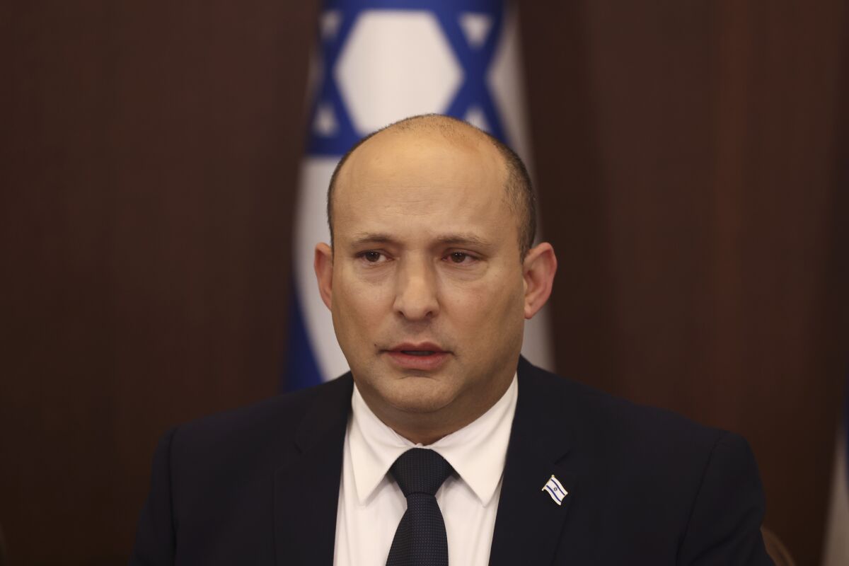 Israeli Prime Minister Naftali Bennett attends a cabinet meeting at the Prime Minister's office in Jerusalem, Wednesday, Nov. 3, 2021. Israeli lawmakers are set to begin marathon voting on Wednesday to try and pass the first national budget in three years, a major test for the fractious coalition government that was sworn in earlier this year after four divisive elections. (Ronen Zvulun/Pool Photo via AP)