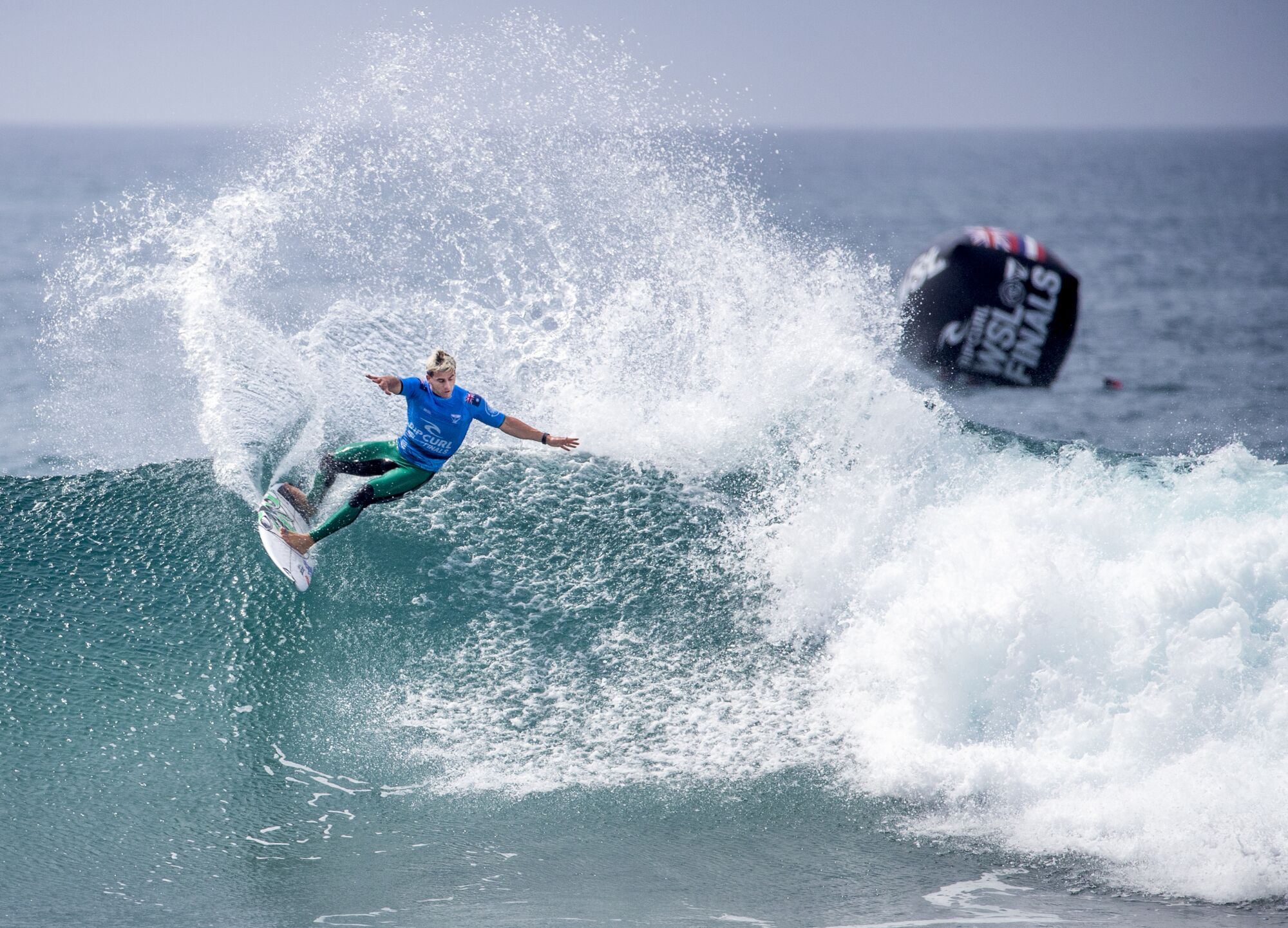 Jack Robinson of Australia slashes high on a wave at the WSL Finals.