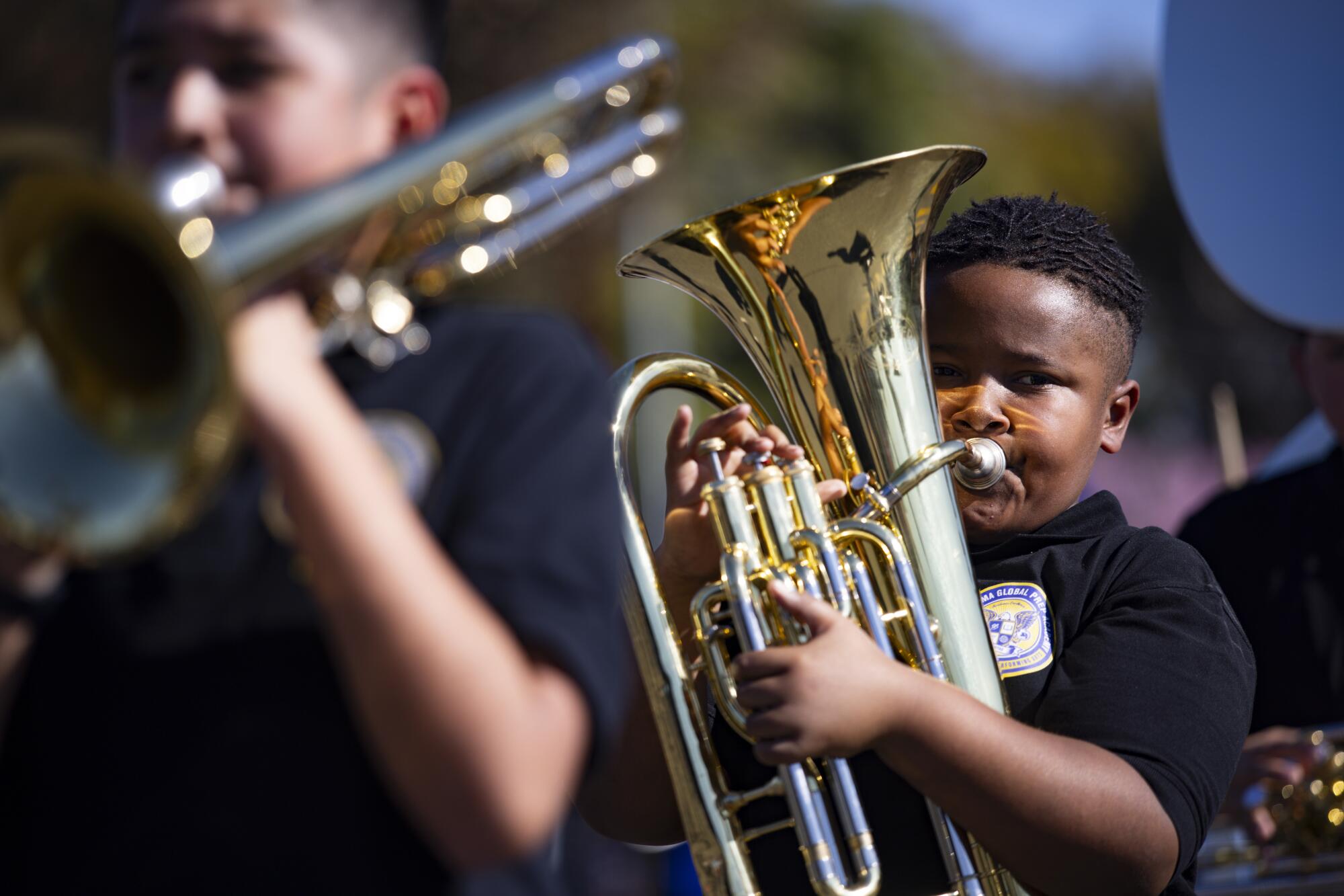 A member of the Barack Obama Global Preparation Academy marching band plays the tuba during Parade.