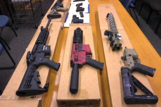 FILE - This Nov. 27, 2019 file photo shows "ghost guns" on display at the headquarters of the San Francisco Police Department in San Francisco. Families of those killed and wounded in a rural California shooting rampage three years ago are suing manufacturers and sellers of "ghost gun" kits that provide easy-to-assemble firearm parts that make it difficult to track or regulate owners. (AP Photo/Haven Daley, FIle)