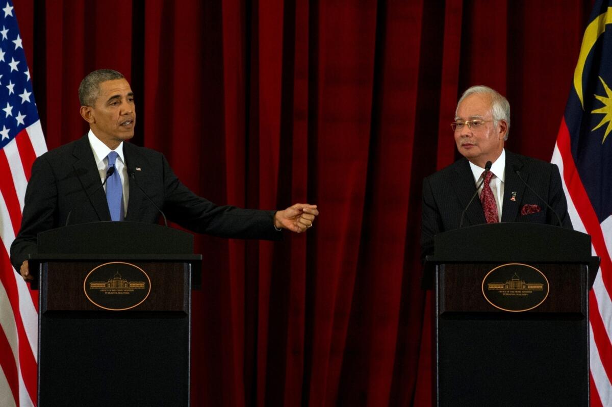 President Obama and Malaysian Prime Minister Najib Razak hold a news conference Sunday outside Kuala Lumpur.