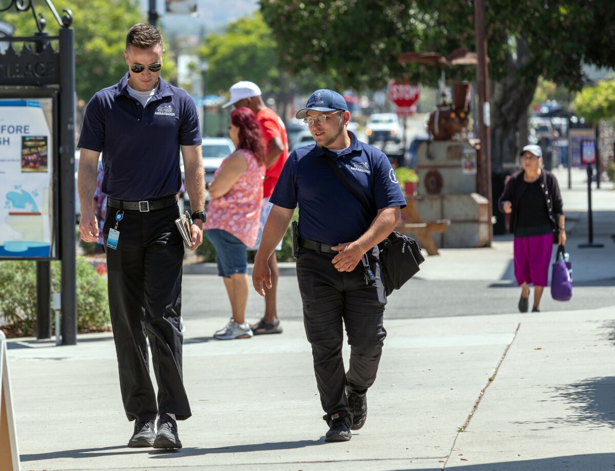 Vista Clean and Safe ambassadors Walter Rekoski Arthur Schwab patrol Main Street.