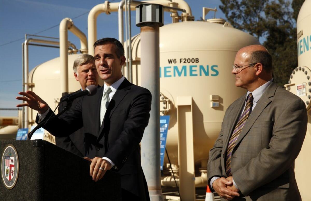 Mayor Eric Garcetti is flanked by Jim McDaniel, left, interim general manager of the Department of Water & Power, and Marty Adams, head of water operations at DWP, at a news conference last week to discuss the drought.