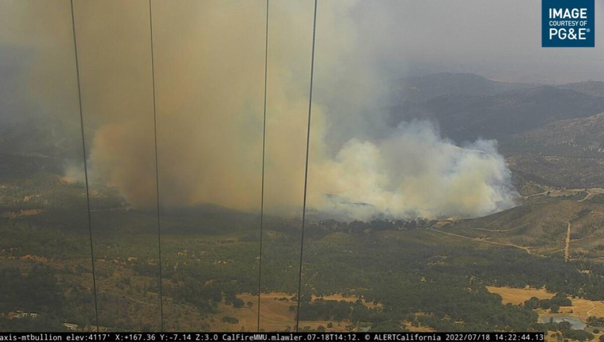 An image provided by PG&E shows a brush fire.