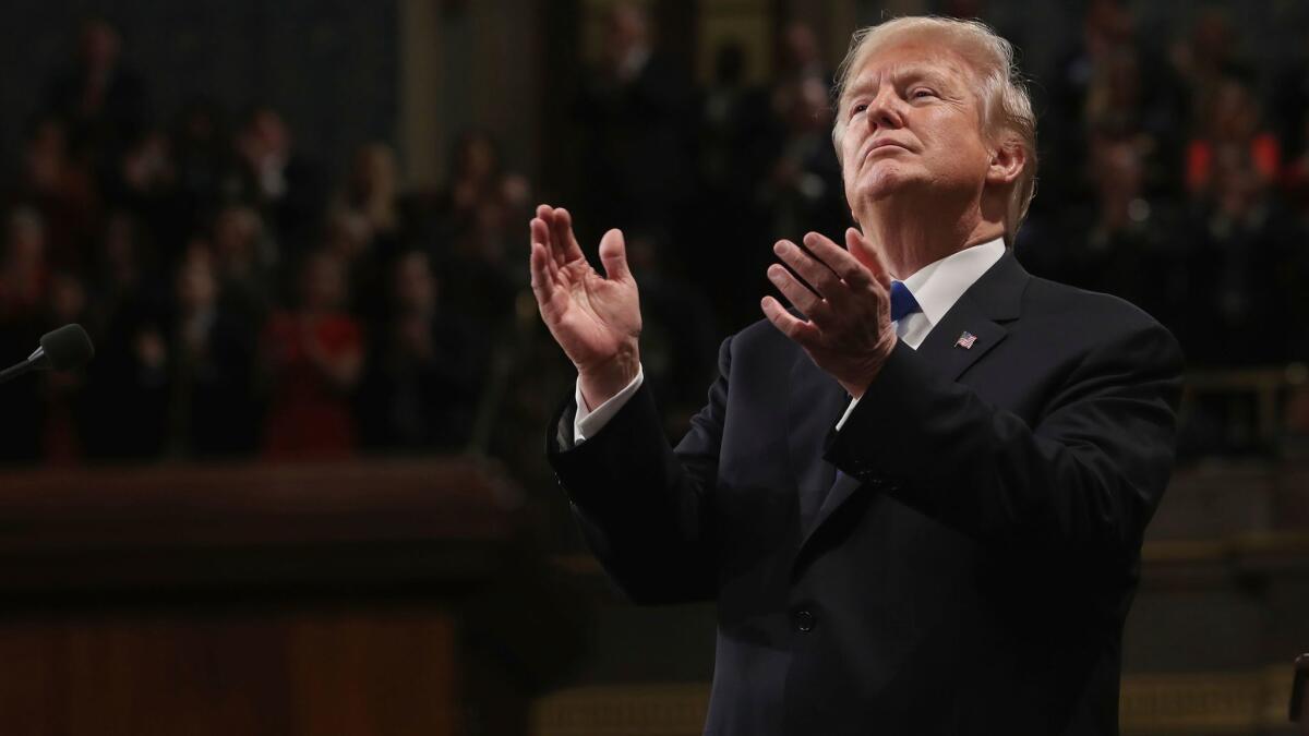 President Trump claps at his first State of the Union address on Capitol Hill on Jan. 30.