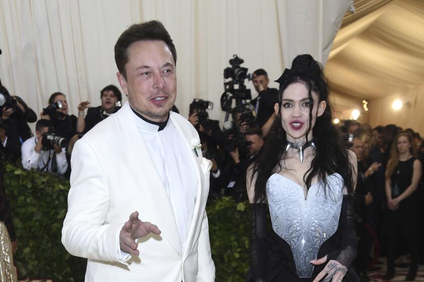 Elon Musk, left and Grimes attend The Metropolitan Museum of Art's Costume Institute benefit gala celebrating the opening of the Heavenly Bodies: Fashion and the Catholic Imagination exhibition on Monday, May 7, 2018, in New York. (Photo by Evan Agostini/Invision/AP)