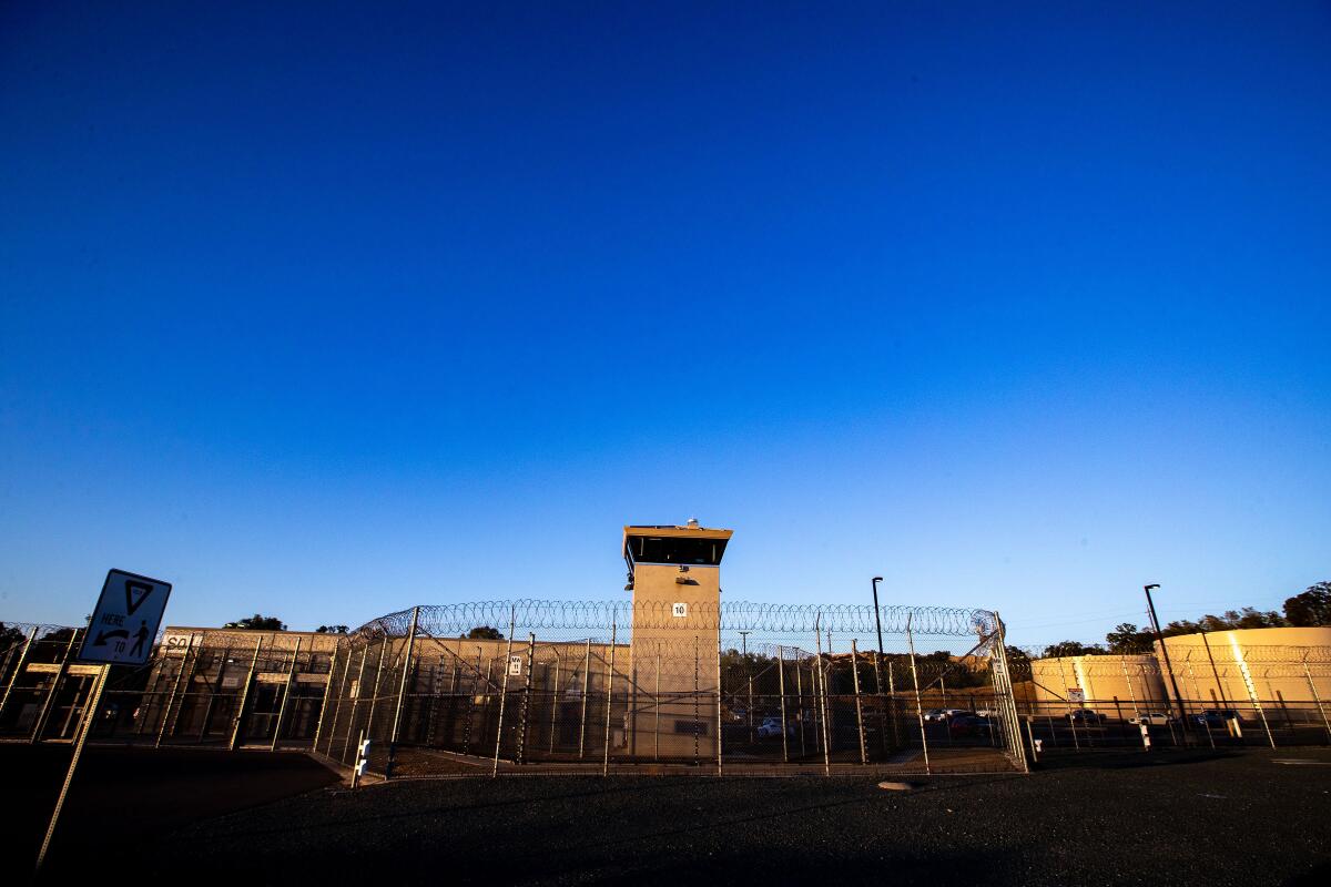 Fencing and a guard tower at Mule Creek State Prison in Ione, Calif. 