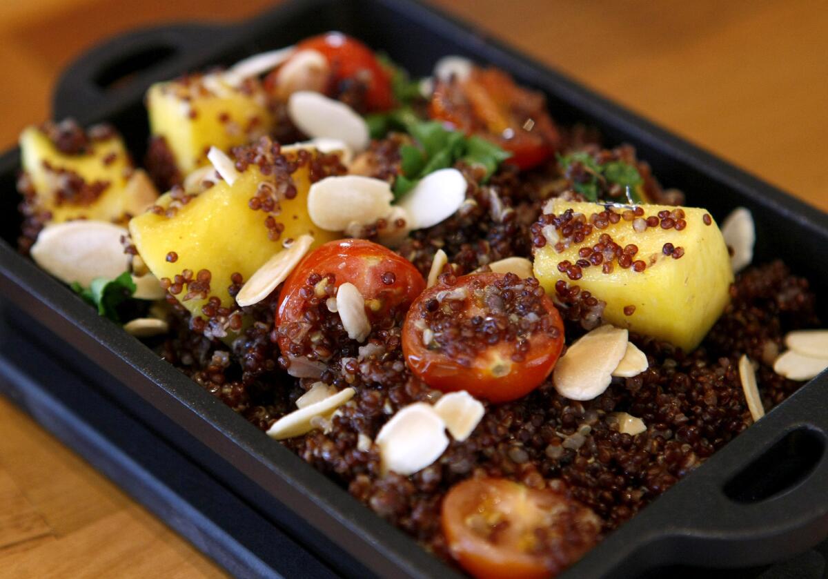 The Peruvian purple quinoa is served warm with shallots, Italian parsley, almonds and sauted mango, at Brand158 Restaurant & Bar in on the 100 block of S. Brand in Glendale, on Thursday, January 2, 2014.