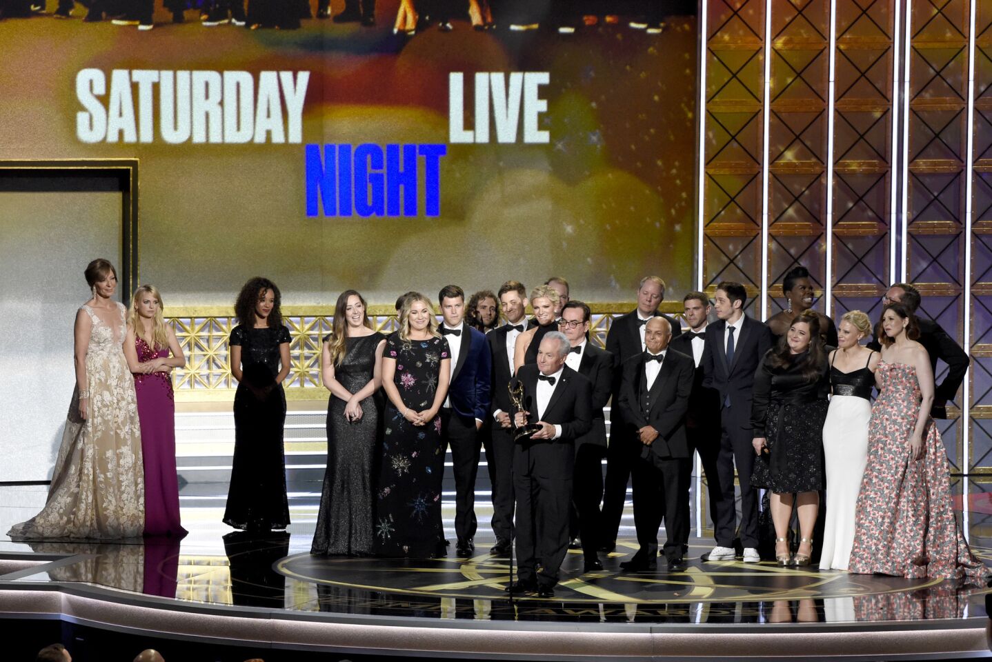 Lorne Michaels and the cast of "SNL" accept the award for outstanding variety sketch series for "Saturday Night Live" at the 69th Emmy Awards.
