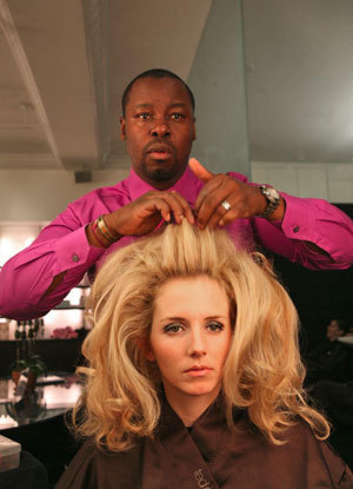 Gibson creates the big look on Nikki McHale at his Fifth Avenue salon.