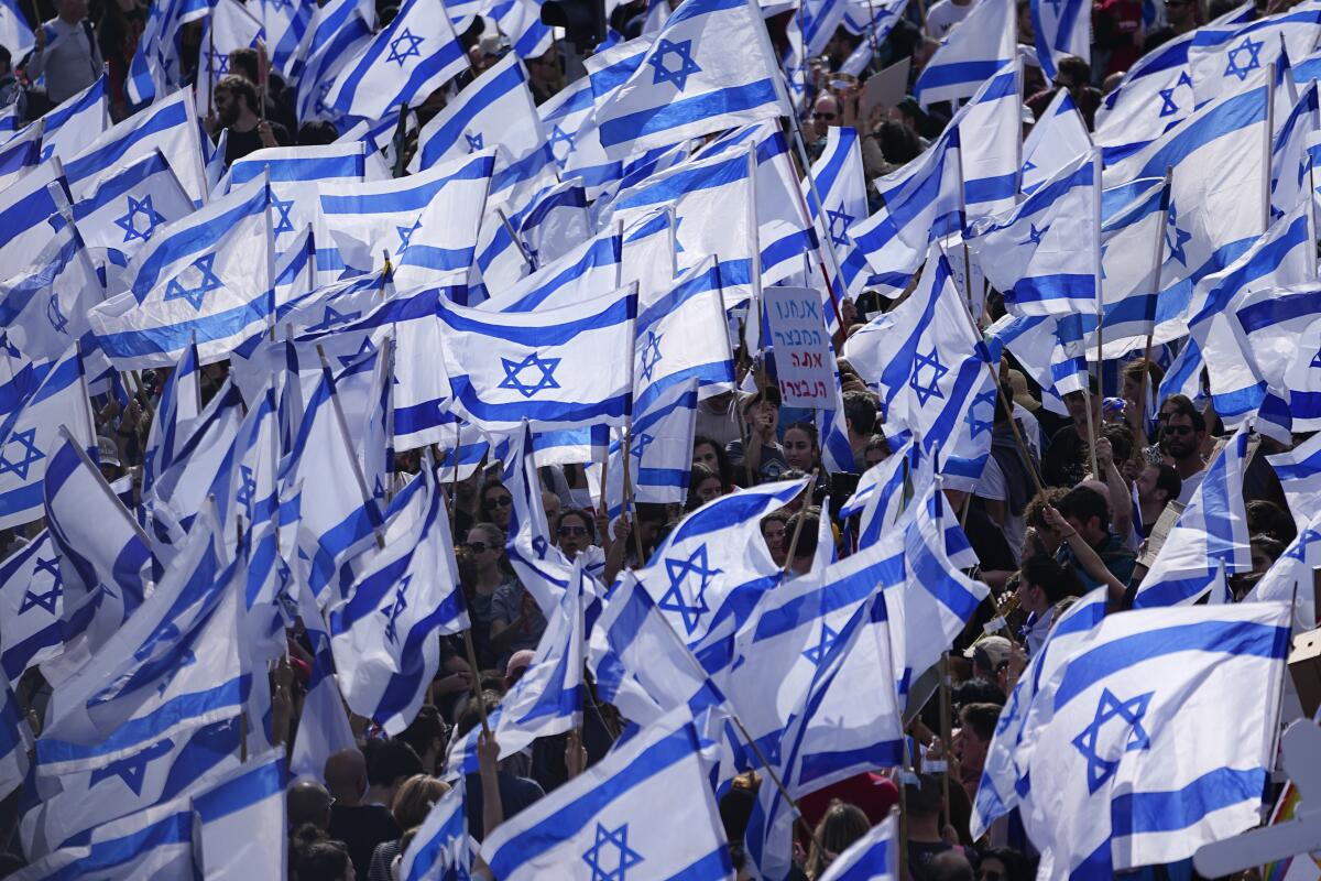 Dozens of Israeli flags.