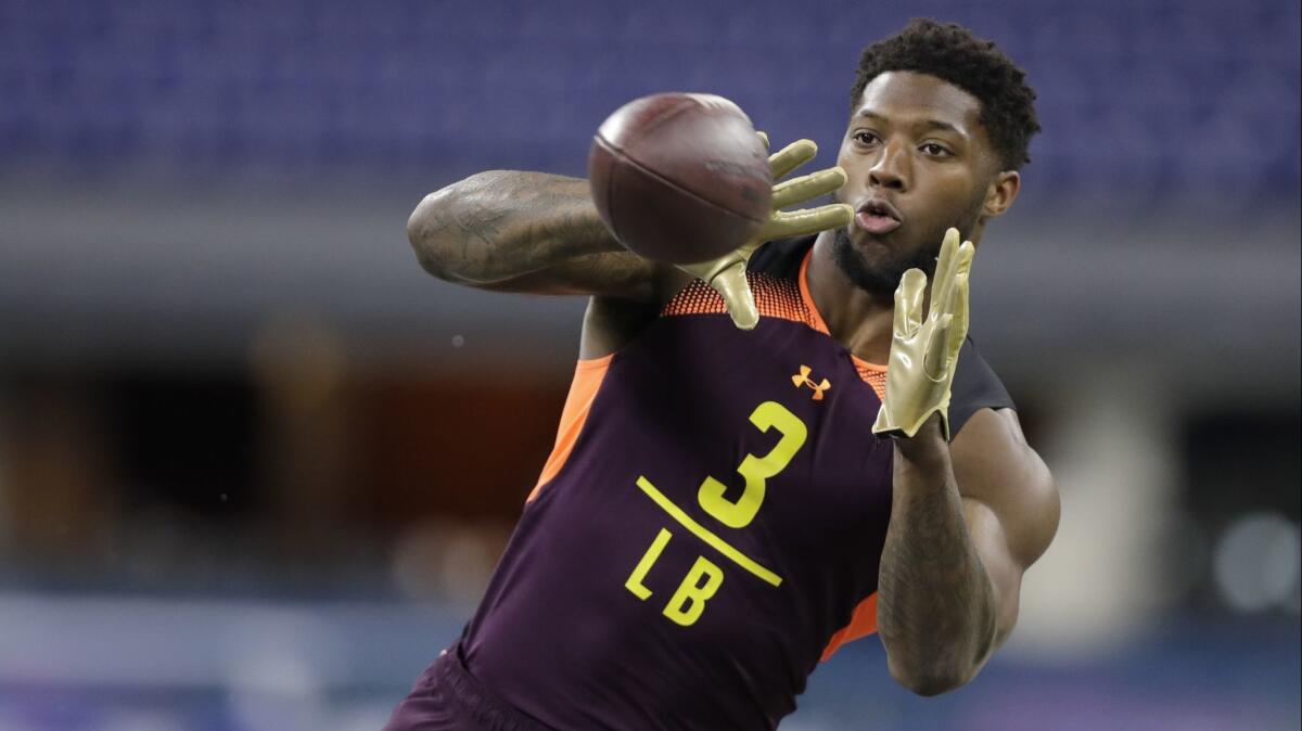 Kentucky linebacker Josh Allen runs a drill during the NFL football scouting combine, Sunday, March 3, 2019, in Indianapolis. (AP Photo/Darron Cummings)