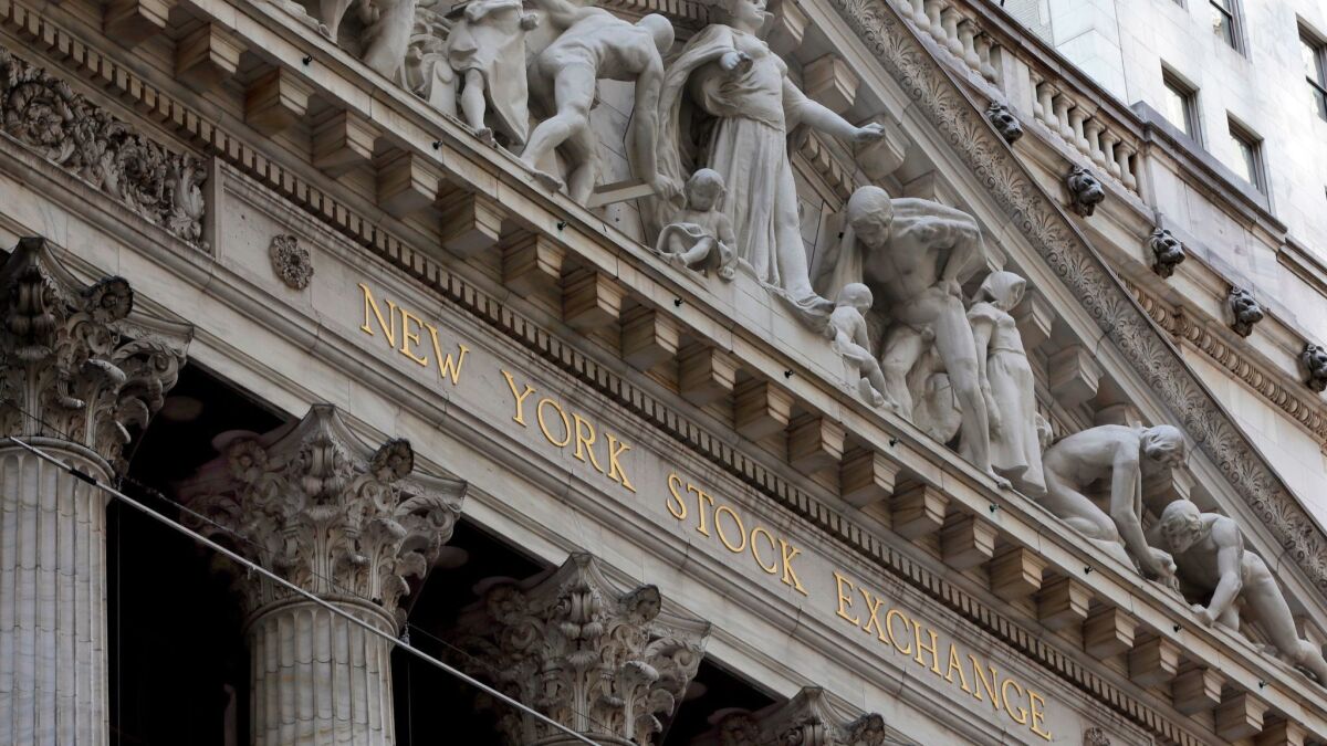 Companies that sell computer chips, oil, basic materials and heavy machinery dropped after the Trump administration proposed a 10% tax on a wide list of imports. Above, the facade of the New York Stock Exchange.