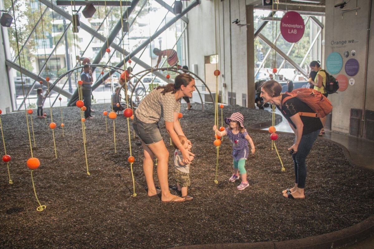 Kids and adults connect in the motion-activated sound-playground of ‘Orange We.’ Maurice Hewitt