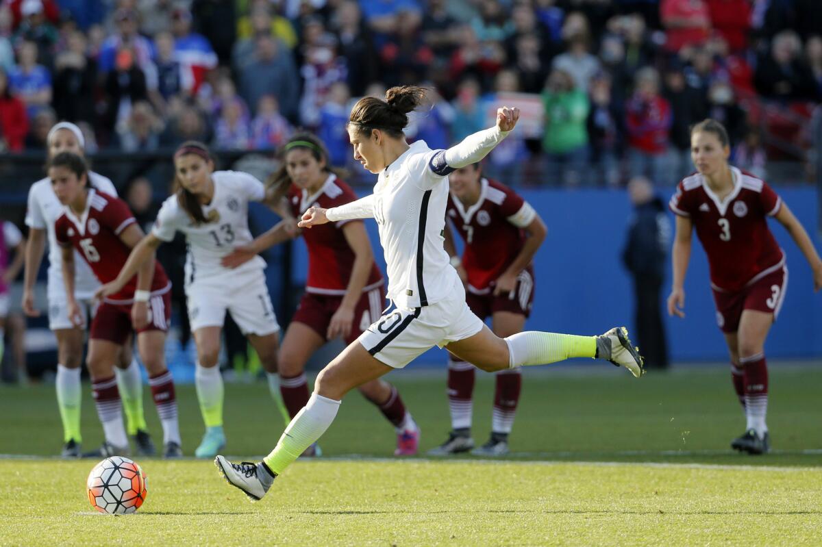 United States midfielder Carli Lloyd charges the ball on a penalty kick against Mexico in the second half of a CONCACAF Olympic qualifying match on Feb. 13.