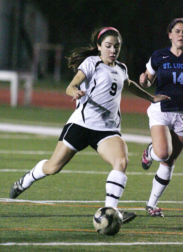 Sacred Heart's Laura Thompson shoots in the first half to score the first goal in the game against St. Lucy's in a non league girls' soccer match at Occidental College in Los Angeles on Friday, December 21, 2012.