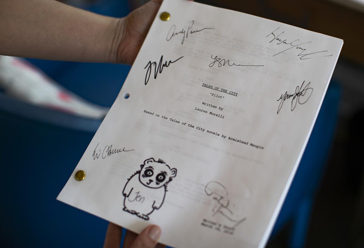 Showrunner Lauren Morelli holds her signed pilot script for Netflix's follow-up to the 1993 miniseries version of Armistead Maupin's "Tales of the City."